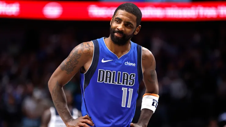 Kyrie Irving #11 of the Dallas Mavericks reacts in an NBA game.