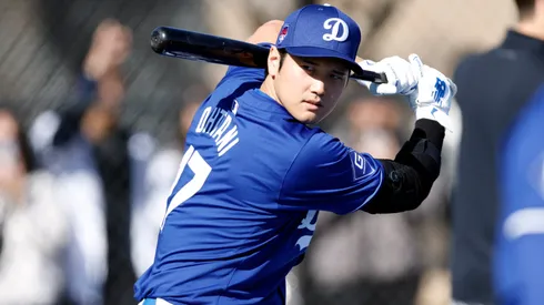 Shohei Ohtani #17 of the Los Angeles Dodgers swings the bat during workouts at Camelback Ranch on February 14, 2024.