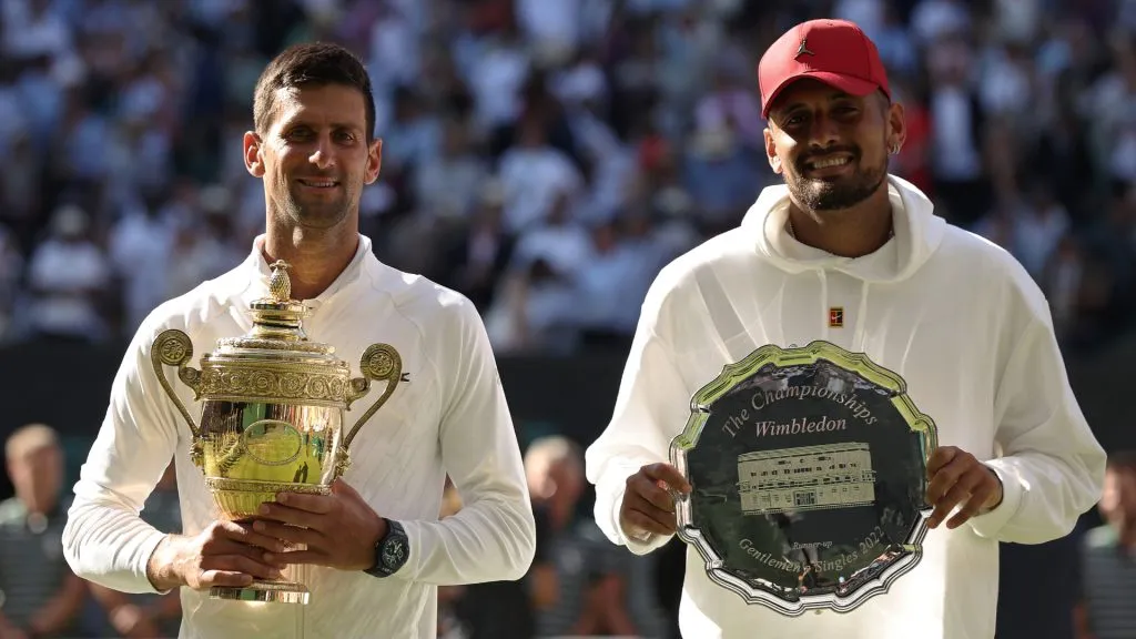 Winner Novak Djokovic of Serbia (L) and runner up Nick Kyrgios of Australia pose for a photo with their trophies at Wimbledon. (Julian Finney/Getty Images)