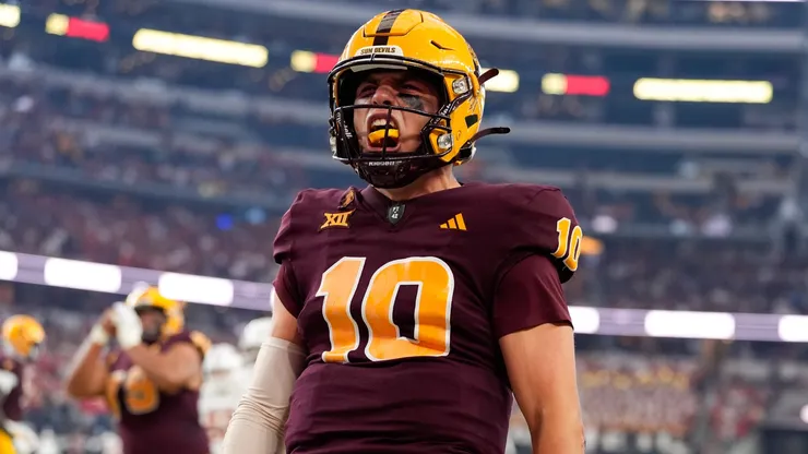 Arizona State quarterback Sam Leavitt (10) gestures after scoring a rushing touchdown during the first half of the Big 12 Championship football game between the Arizona State Sun Devils and the Iowa State Cyclones on December 7, 2024 in Arlington, Texas. Arizona State won, 45-19.