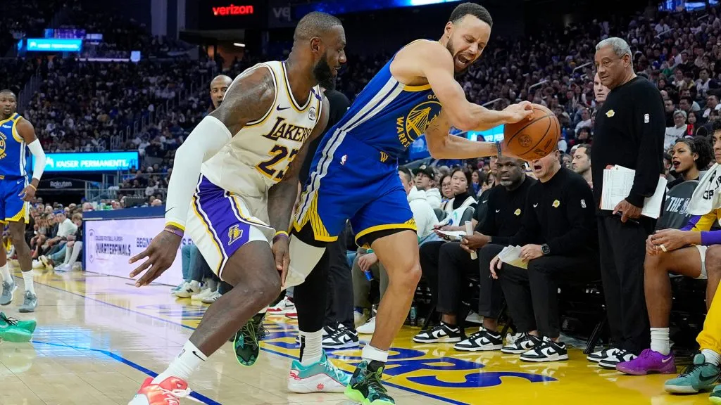 Stephen Curry #30 of the Golden State Warriors is fouled by LeBron James #23 of the Los Angeles Lakers during the second half at Chase Center on Christmas Day. (Thearon W. Henderson/Getty Images)