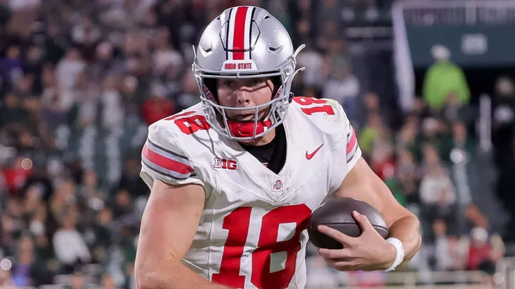 Ohio State Buckeyes quarterback Will Howard (18) carries the ball during the game between the Ohio State Buckeyes and Michigan State Spartans at Spartan Stadium, East Lansing, Michigan.