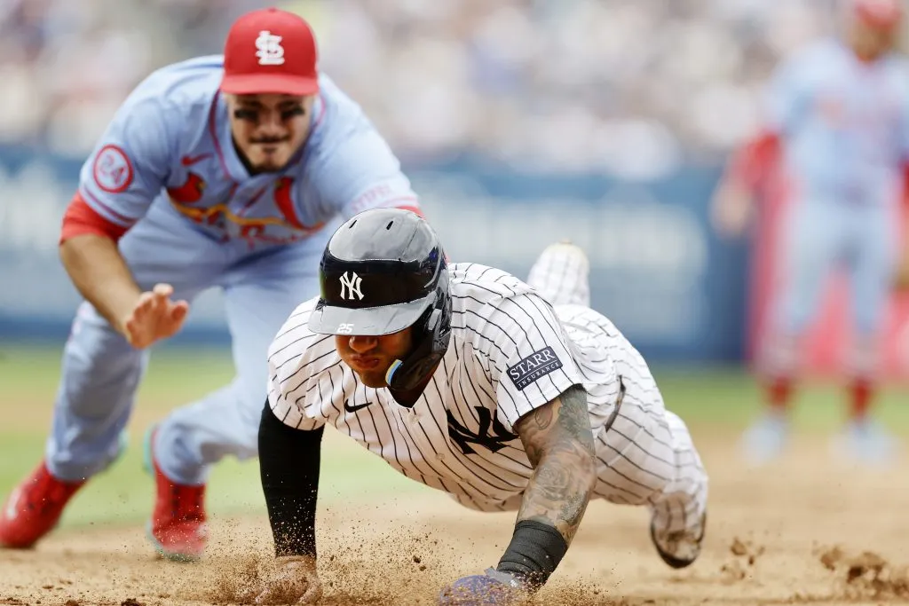 Gleyber Torres #25 of the New York Yankees is tagged out by Nolan Arenado #28 of the St. Louis Cardinals