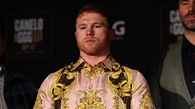 Boxer Canelo Alvarez poses with his championship belts at the end of the press conference during the press tour for his fight against Gennady Golovkin on June 27, 2022 in New York City.
