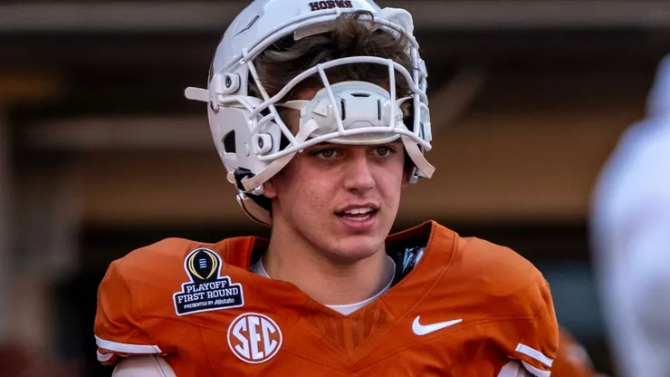 Arch Manning 16 of the Texas Longhorns during warmups before the game vs the Clemson Tigers in the first round of the playoffs at DKR-Memorial Stadium.
