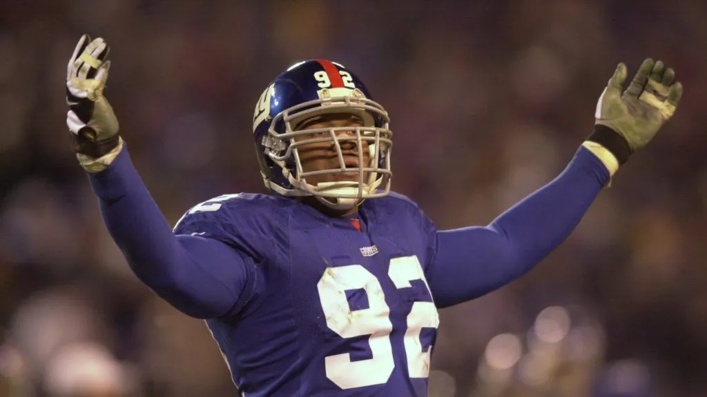 Michael Strahan #92 of the New York Giants celebraters after sacking Donovan McNabb #5 of the Philadelphia Eagles during the second period of the NFC Divisional playoff game in 2001. (Source: Ezra Shaw/ALLSPORT)