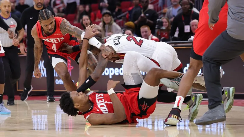Jalen Green #4 and Amen Thompson #1 of the Houston Rockets fight with Terry Rozier #2 of the Miami Heat during the second half. (Alex Slitz/Getty Images)