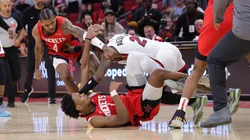 Jalen Green #4 and Amen Thompson #1 of the Houston Rockets fight with Terry Rozier #2 of the Miami Heat during the second half at Toyota Center on December 29, 2024 in Houston, Texas.