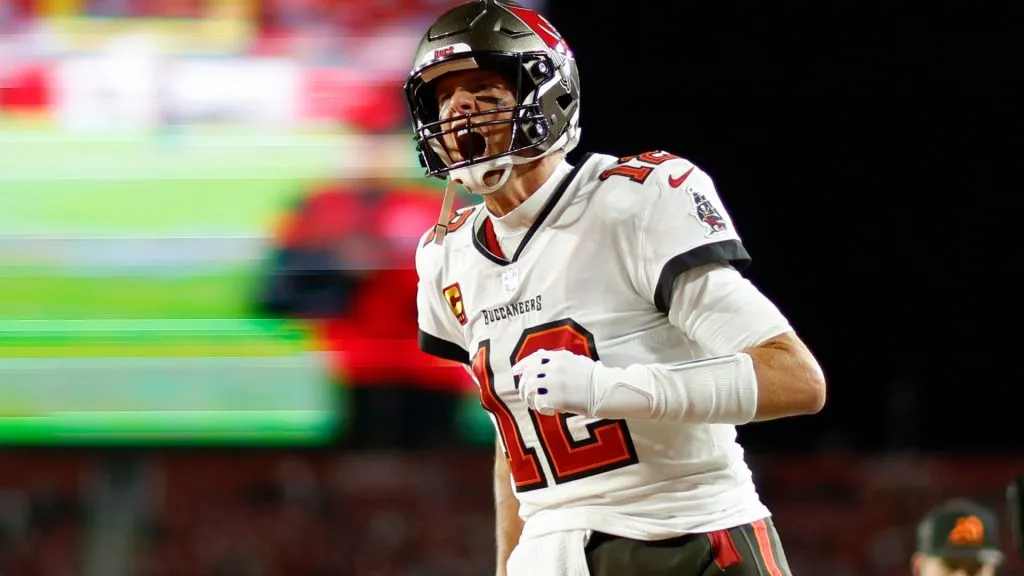 Tom Brady #12 of the Tampa Bay Buccaneers warms up prior to a game against the Dallas Cowboys in the NFC Wild Card playoff game at Raymond James Stadium on January 16, 2023. (Source: Mike Ehrmann/Getty Images)