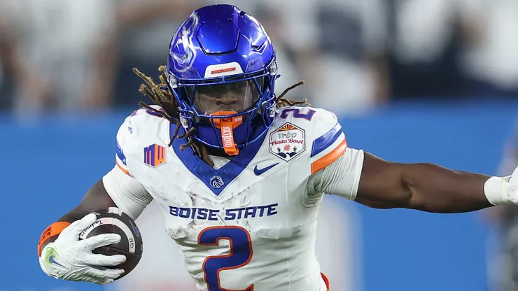 Ashton Jeanty #2 of the Boise State Broncos runs the ball against Tony Rojas #13 of the Penn State Nittany Lions during the first half in the 2024 Vrbo Fiesta Bowl at State Farm Stadium on December 31, 2024 in Glendale, Arizona.