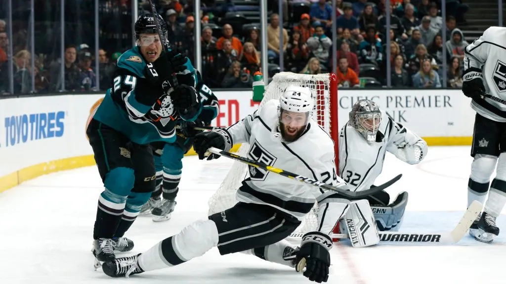 Carter Rowney #24 of the Anaheim Ducks and Derek Forbort #24 of the Los Angeles Kings go after the puck during the third period at Honda Center on March 10, 2019. (Source: Katharine Lotze/Getty Images)