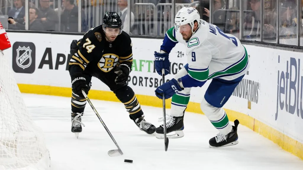 J.T. Miller #9 of the Vancouver Canucks skates away from Jake DeBrusk #74 of the Boston Bruins during the second period at the TD Garden on February 8, 2024. (Source: Rich Gagnon/Getty Images)