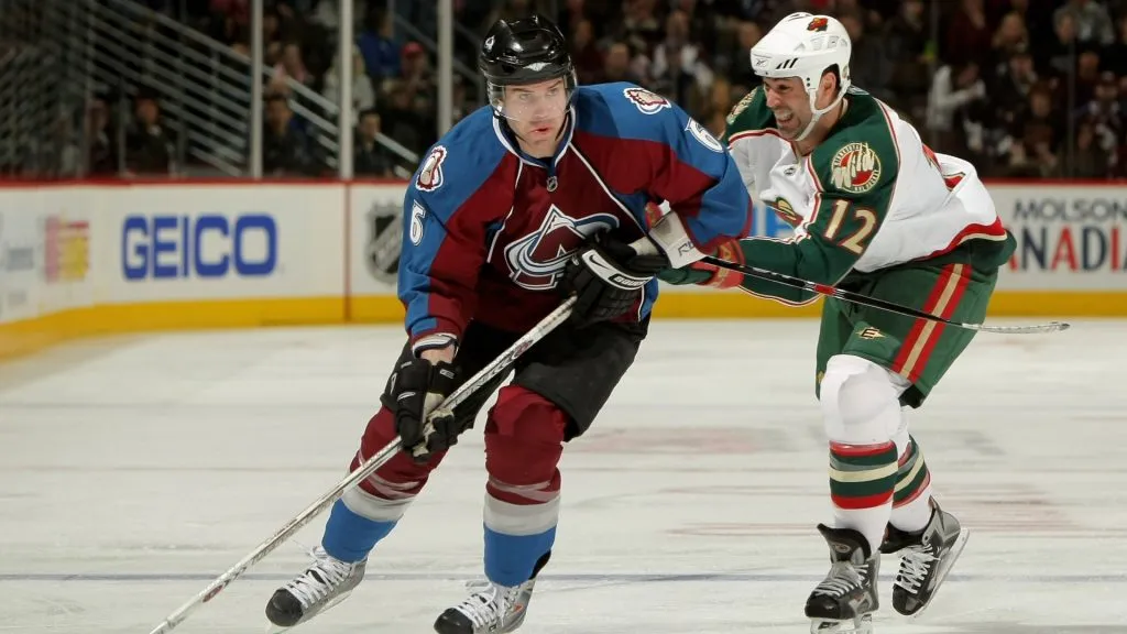Jeff Finger #6 of the Colorado Avalanche controls the puck as Brian Rolston #12 of the Minnesota Wild defends at the Pepsi Center on April 6, 2008. (Source: Doug Pensinger/Getty Images)