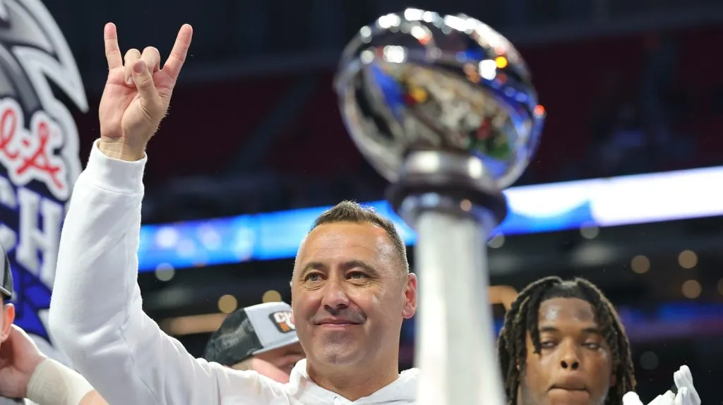 Head coach Steve Sarkisian of the Texas Longhorns celebrates during the trophy presentation after defeating the Arizona State Sun Devils 39-31 during the second overtime in the Chick-fil-A Peach Bowl at Mercedes-Benz Stadium on January 01, 2025 in Atlanta, Georgia.