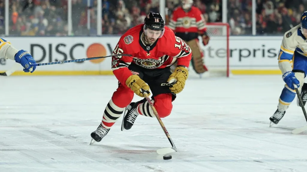Jason Dickinson #16 of the Chicago Blackhawks skates during the second period against the St. Louis Blues in the 2024 NHL Winter Classic at Wrigley Field on December 31, 2024 in Chicago, Illinois.