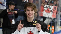Gavin McKenna celebrates with the gold medal after Canada's 6-4 win vs Team USA during the Gold Medal Game at the IIHF U-18 World Championship.