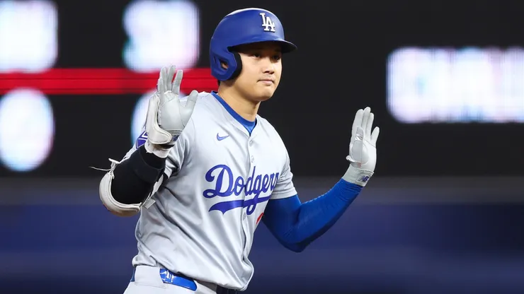 Shohei Ohtani #17 of the Los Angeles Dodgers reacts after hitting a double against the Miami Marlins during the first inning of the game at loanDepot park.