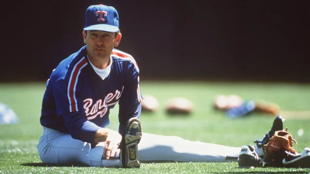 Texas Rangers Pitcher Nolan Ryan stretches before throwing. (Source: Otto Greule/ALLSPORT)