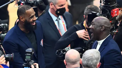 Michael Jordan and LeBron James talk after the presentation of the NBA 75th Anniversary Team during the 2022 NBA All-Star Game at Rocket Mortgage Fieldhouse on February 20, 2022 in Cleveland, Ohio.