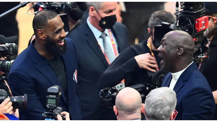 Michael Jordan and LeBron James talk after the presentation of the NBA 75th Anniversary Team during the 2022 NBA All-Star Game at Rocket Mortgage Fieldhouse on February 20, 2022 in Cleveland, Ohio.