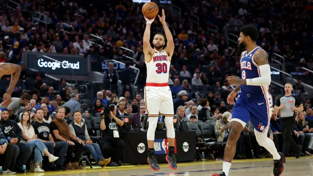 Stephen Curry #30 of the Golden State Warriors shoots over Paul George #8 of the Philadelphia 76ers during the second half at Chase Center. (Ezra Shaw/Getty Images)