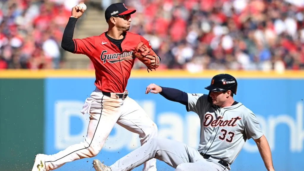 Andrés Giménez #0 of the Cleveland Guardians turns a double play forcing Colt Keith #33 of the Detroit Tigers out during the fourth inning in Game One of the Division Series in 2024. (Source: Nick Cammett/Getty Images)