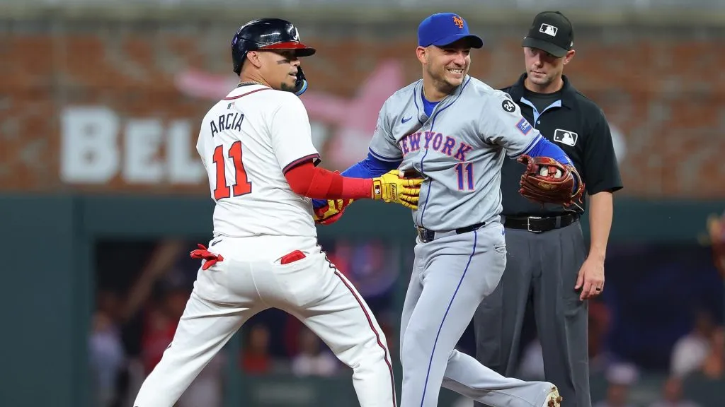 Orlando Arcia #11 of the Atlanta Braves and Jose Iglesias #11 of the New York Mets horse around at second base after Arcia’s single leading off the third inning on September 24, 2024. (Source: Kevin C. Cox/Getty Images)
