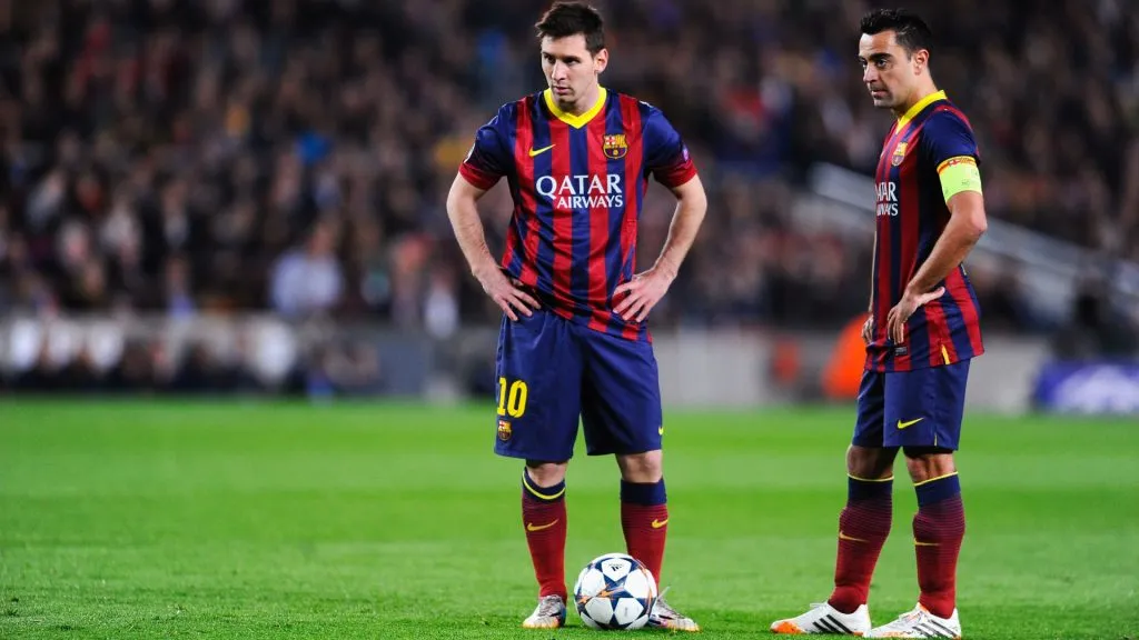 Lionel Messi and Xavi Hernandez of Barcelona prepare to take a free kick during the UEFA Champions League Quarter Final match against Atletico Madrid. (David Ramos/Getty Images)