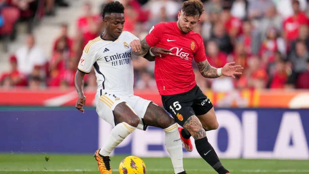 Vinicius Junior of Real Madrid competes for the ball with Pablo Maffeo of RCD Mallorca. (Aitor Alcalde/Getty Images)