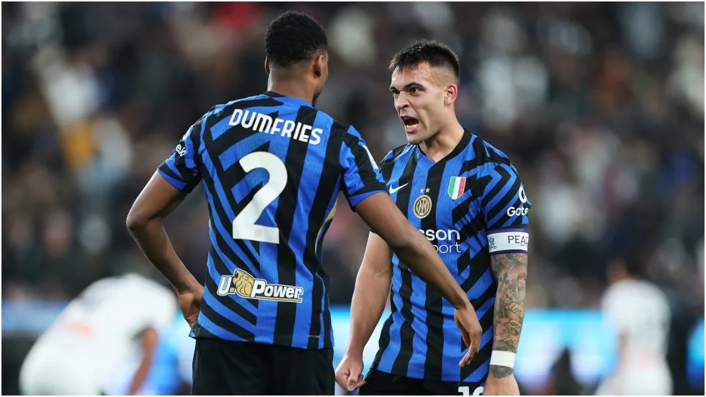 Denzel Dumfries of FC Inter celebrates with Lautaro Martinez – Abdullah Ahmed/Getty Images