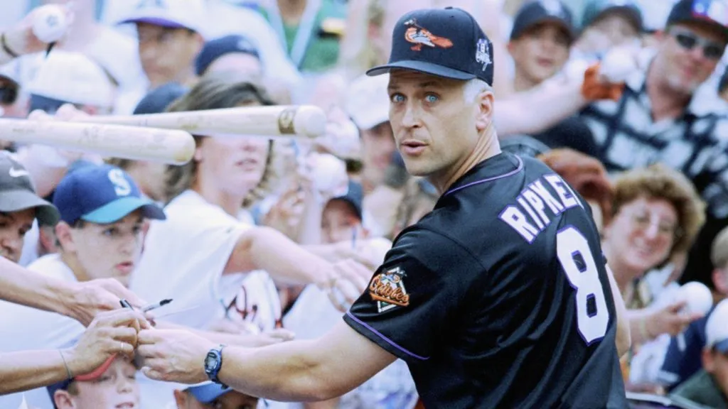 Cal Ripken Jr. of the American League signs autographs for fans during the MLB All-Star Game at Coors Field on July 7, 1998. (Source: Jed Jacobsohn/Getty Images)