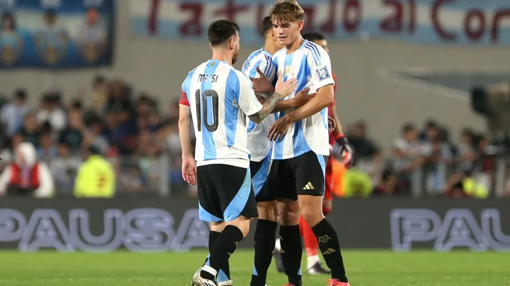 Lionel Messi of Argentina greets teammate Nico Paz after winning the FIFA World Cup 2026 South American Qualifier match between Argentina and Bolivia. (Daniel Jayo/Getty Images)