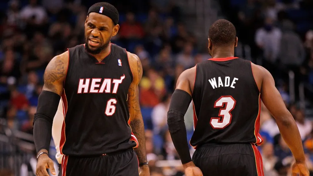LeBron James #6 and Dwyane Wade #3 of the Miami Heat high-five after a play during a preseason game against the Orlando Magic. (Mike Ehrmann/Getty Images)