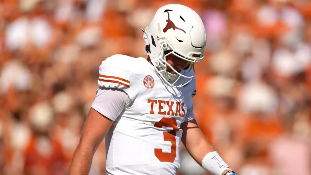 Quinn Ewers #3 of the Texas Longhorns reacts during the first half against the Oklahoma Sooners at Cotton Bowl Stadium on October 12, 2024 in Dallas, Texas.