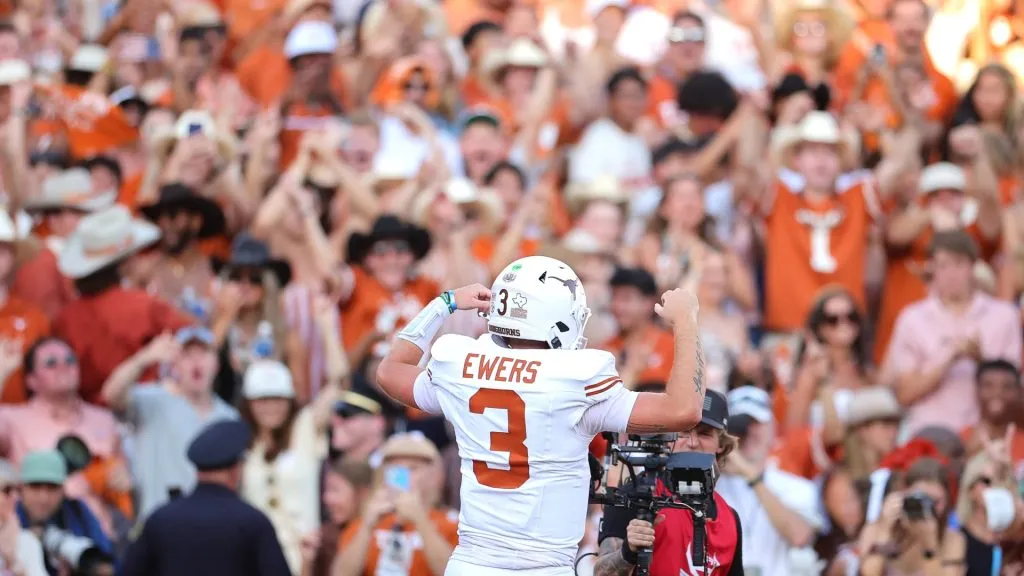 Quinn Ewers #3 of the Texas Longhorns reacts as fans cheer during the fourth quarter against the Oklahoma Sooners at Cotton Bowl Stadium on October 12, 2024 in Dallas, Texas.