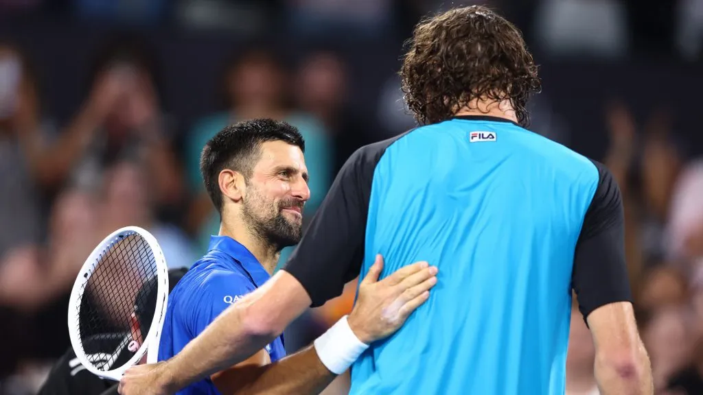 Novak Djokovic of Serbia and Reilly Opelka of the USA after their quarter-final match at Brisbane. (Chris Hyde/Getty Images)