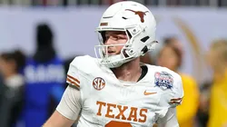 Quinn Ewers #3 of the Texas Longhorns reacts after throwing a pass for a touchdown during the first overtime against the Arizona State Sun Devils in the Chick-fil-A Peach Bowl at Mercedes-Benz Stadium on January 01, 2025 in Atlanta, Georgia.