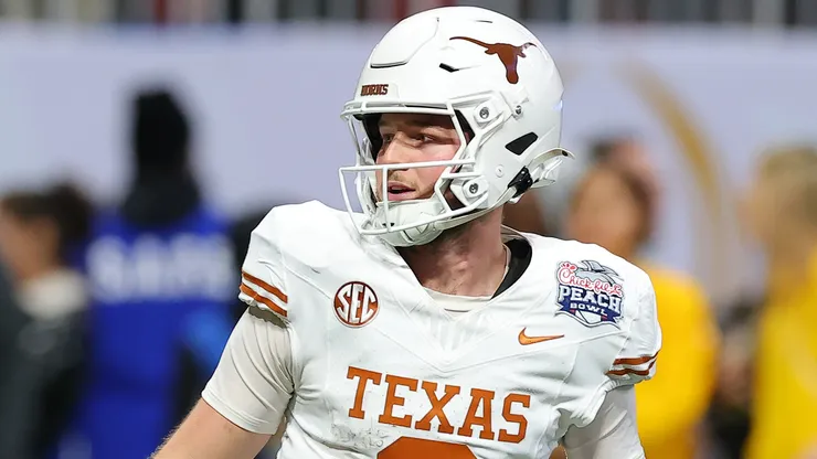 Quinn Ewers #3 of the Texas Longhorns reacts after throwing a pass for a touchdown during the first overtime against the Arizona State Sun Devils in the Chick-fil-A Peach Bowl at Mercedes-Benz Stadium on January 01, 2025 in Atlanta, Georgia.