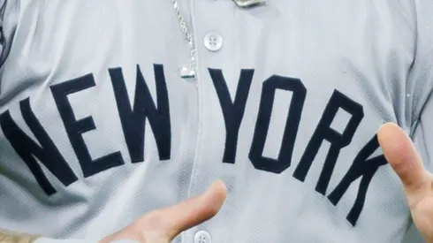 A close-up of Alex Verdugo (#24) of the New York Yankees celebrating after scoring off an Aaron Judge (#99) single in the ninth inning during their MLB game against the Toronto Blue Jays at Rogers Centre on April 17, 2024, in Toronto, Canada.