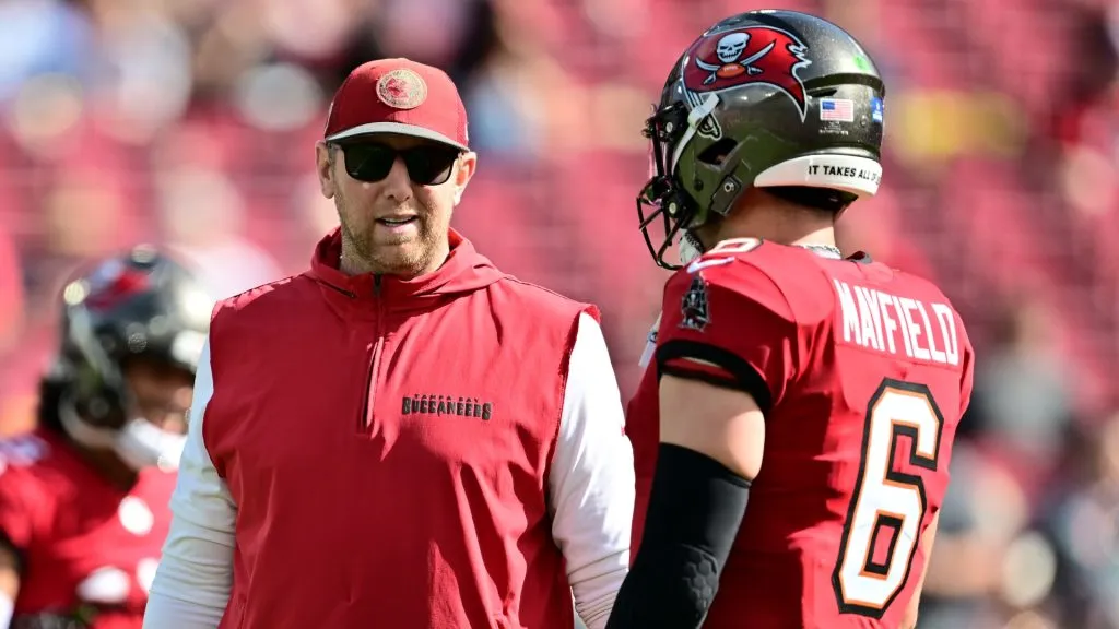 Liam Coen and Baker Mayfield talk on the sideline