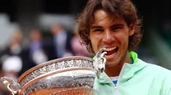 Rafael Nadal celebrates with the trophy after winning the men's singles final match between Rafael Nadal and Robin Soderling on day fifteen of the French Open in 2010.