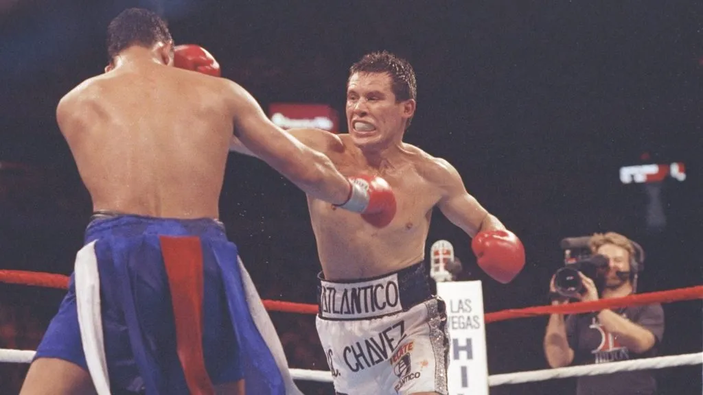 Julio C. Chavez lands a straight right on Hector Camacho during a bout at the Hilton in Las Vegas on 12 Sep 1992. (Source: Holly Stein /Allsport)