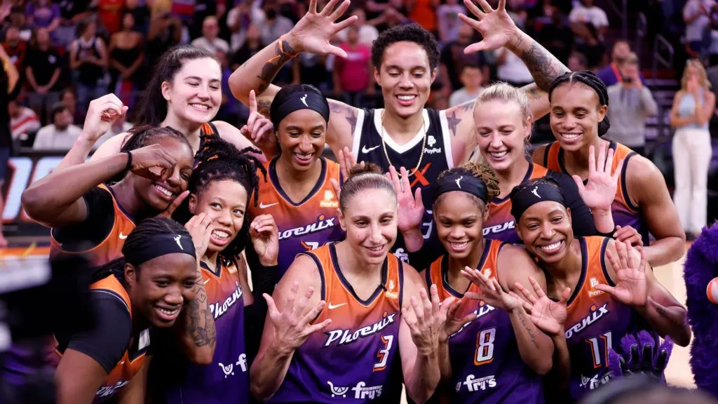Guard Diana Taurasi #3 of the Phoenix Mercury poses for a photo with teammates while being honored after scoring 10,000 career points at Footprint Center on August 03, 2023. (Source: Chris Coduto/Getty Images)
