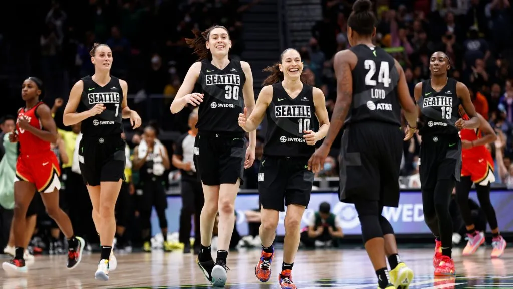 Stephanie Talbot, Breanna Stewart, Sue Bird and Ezi Magbegor of the Seattle Storm celebrate a three point basket by Jewell Loyd during the fourth quarter against the Las Vegas Aces in 2022. (Source: Steph Chambers/Getty Images)