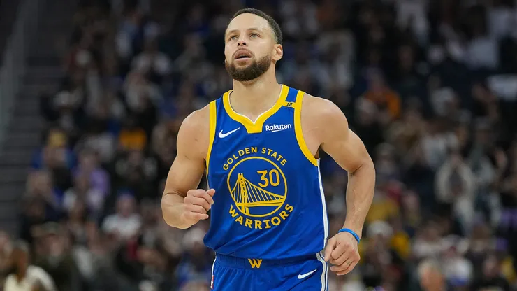 Stephen Curry #30 of the Golden State Warriors reacts after making a three-point shot against the Los Angeles Lakers.