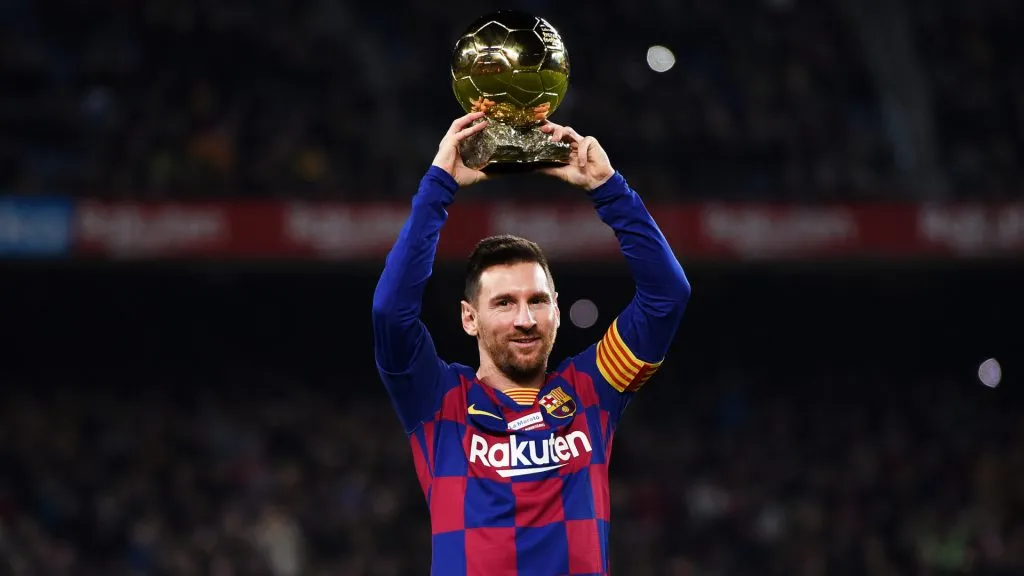 Lionel Messi of FC Barcelona lifts up his sixth Ballon d’Or prior to the Liga match between FC Barcelona and RCD Mallorca at Camp Nou. (Alex Caparros/Getty Images)