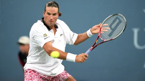 Patrick Rafter of Australia returns the ball during the U.S. Open.