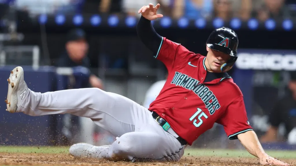 Randal Grichuk #15 of the Arizona Diamondbacks slides home to score a run against the Miami Marlins during the seventh inning of the game at loanDepot park on August 21, 2024 in Miami, Florida. (Photo by Megan Briggs/Getty Images)