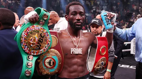Terence Crawford celebrates with his championship belts after defeating Errol Spence Jr. in the World Welterweight Championship bout at T-Mobile Arena on July 29, 2023 in Las Vegas, Nevada.