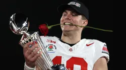 Will Howard #18 of the Ohio State Buckeyes holds the Leishman Trophy after defeating the Oregon Ducks 41-21 in the Rose Bowl Game Presented by Prudential at Rose Bowl Stadium on January 01, 2025 in Pasadena, California.